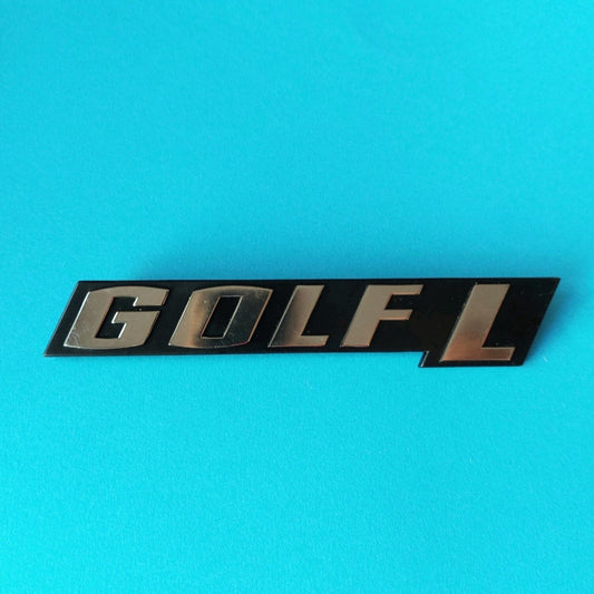 Targhetta GOLF L originale Volkswagen codice 171 853 687 M, vista frontale