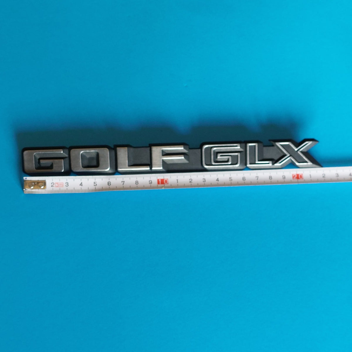 Stemma VW Golf GLX 191 853 687 E con misura circa 22 cm
