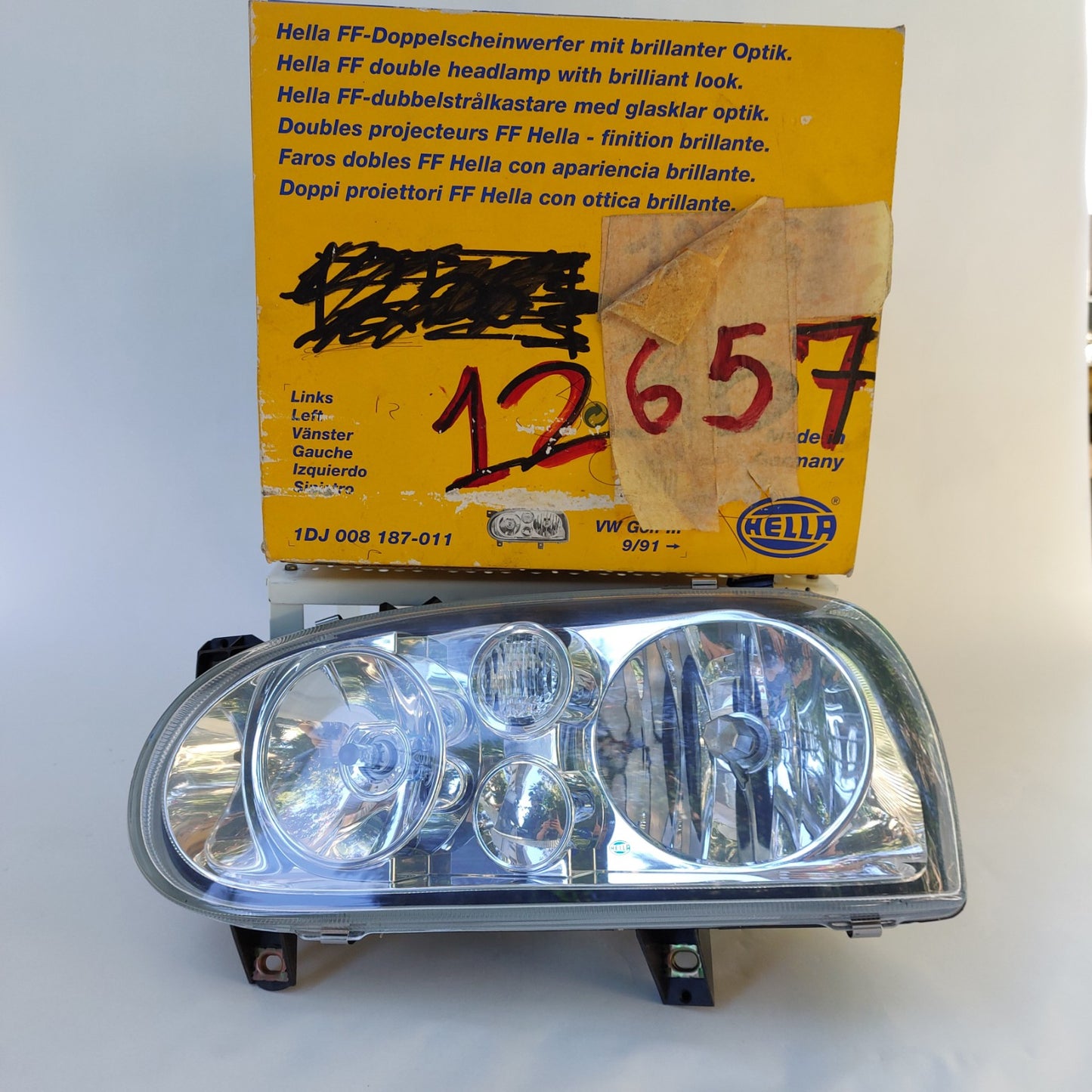 1DJ 008 187-011 Faro anteriore sinistro Hella Klarglas Volkswagen Golf III NOS