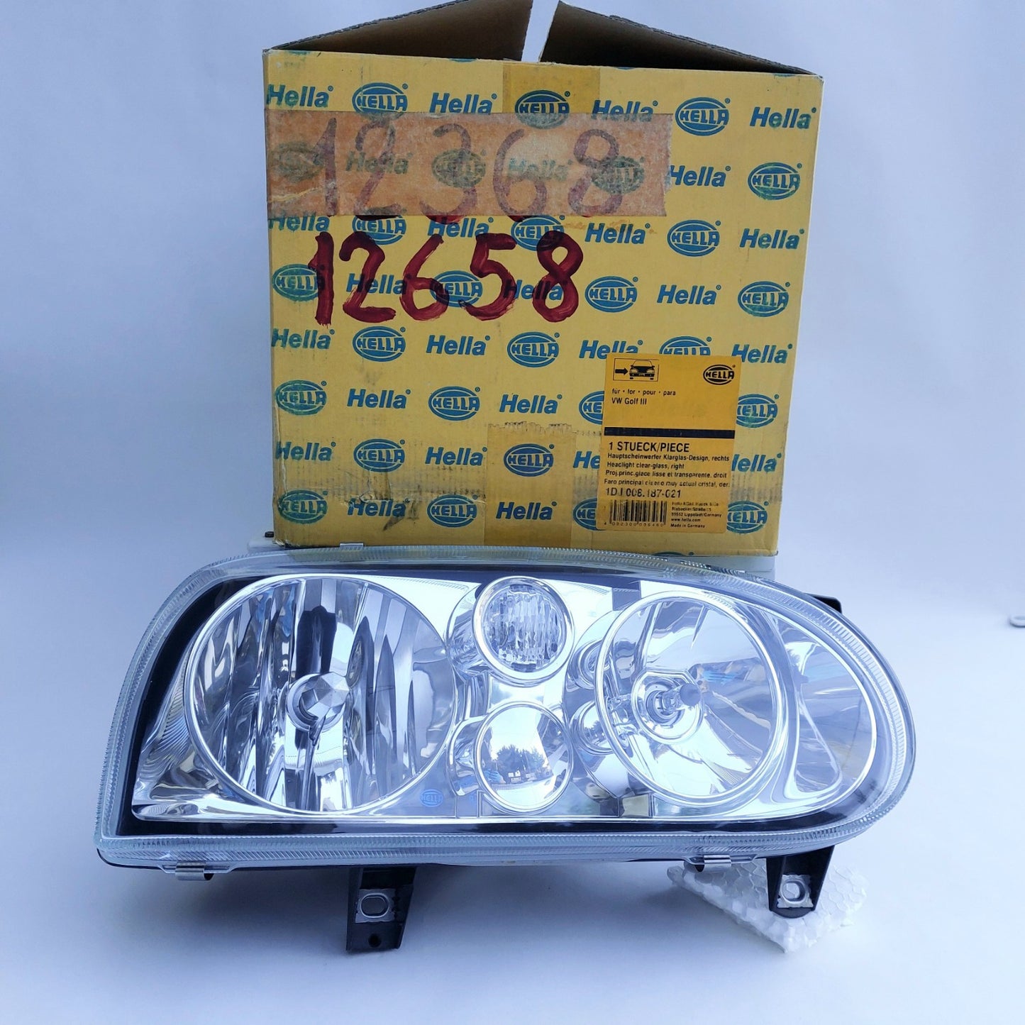 1DJ008187-021 Faro anteriore destro Hella Klarglas VW Golf III NOS