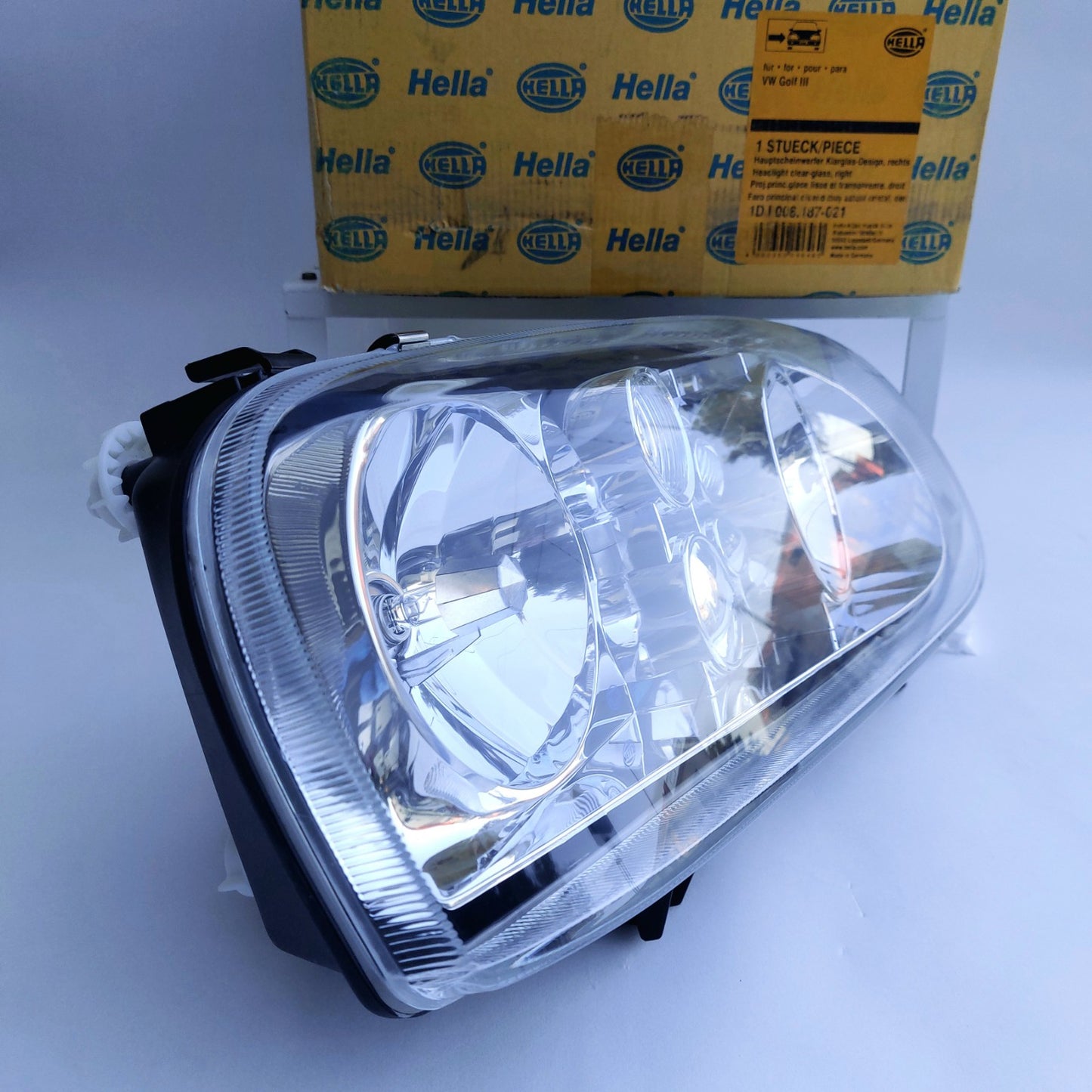 1DJ008187-021 Faro anteriore destro Hella Klarglas VW Golf III NOS