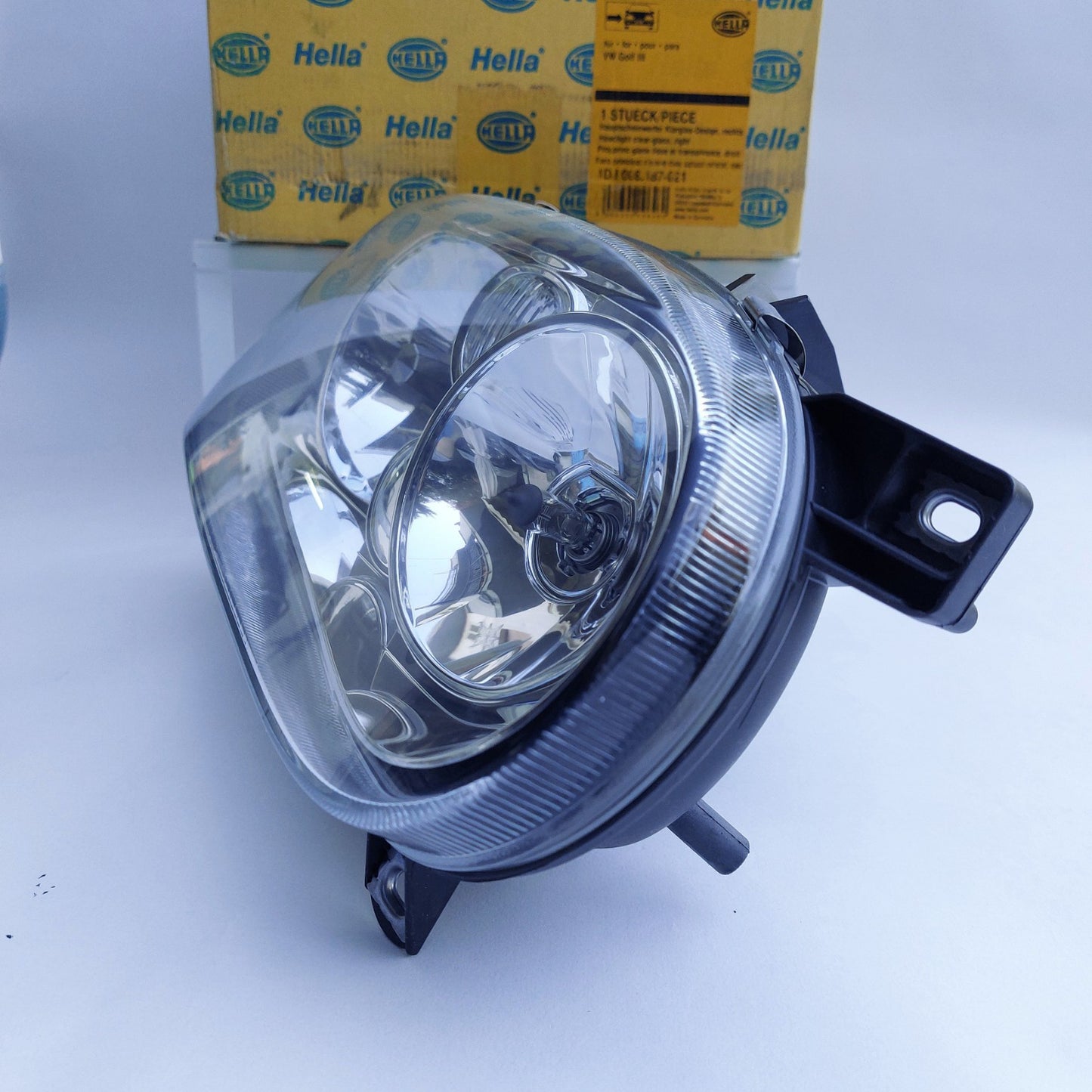 1DJ008187-021 Faro anteriore destro Hella Klarglas VW Golf III NOS